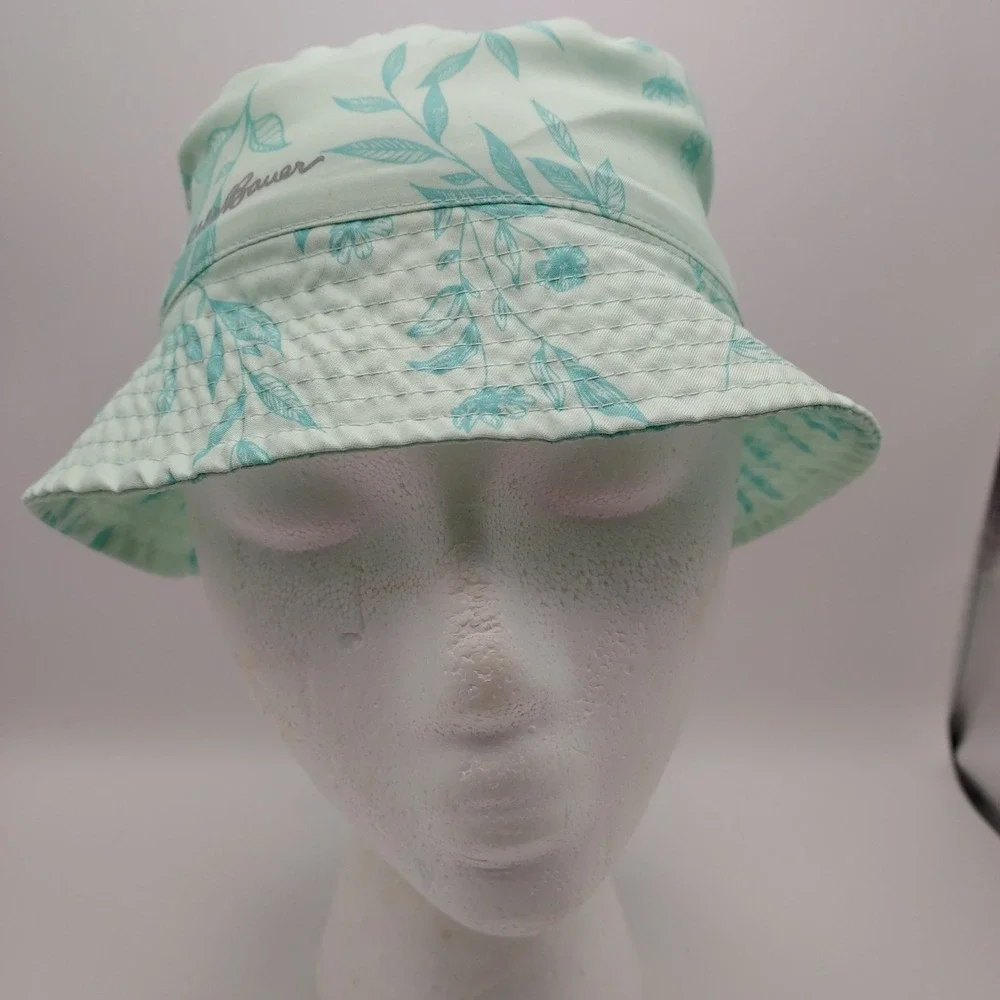 Women's Eddie Bauer floral bucket hat in mint green with aqua blue leaf floral